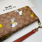 COACH x PEANUTS Long Zip around Wallet Snoopy Woodstock Khaki Signatur - closeup