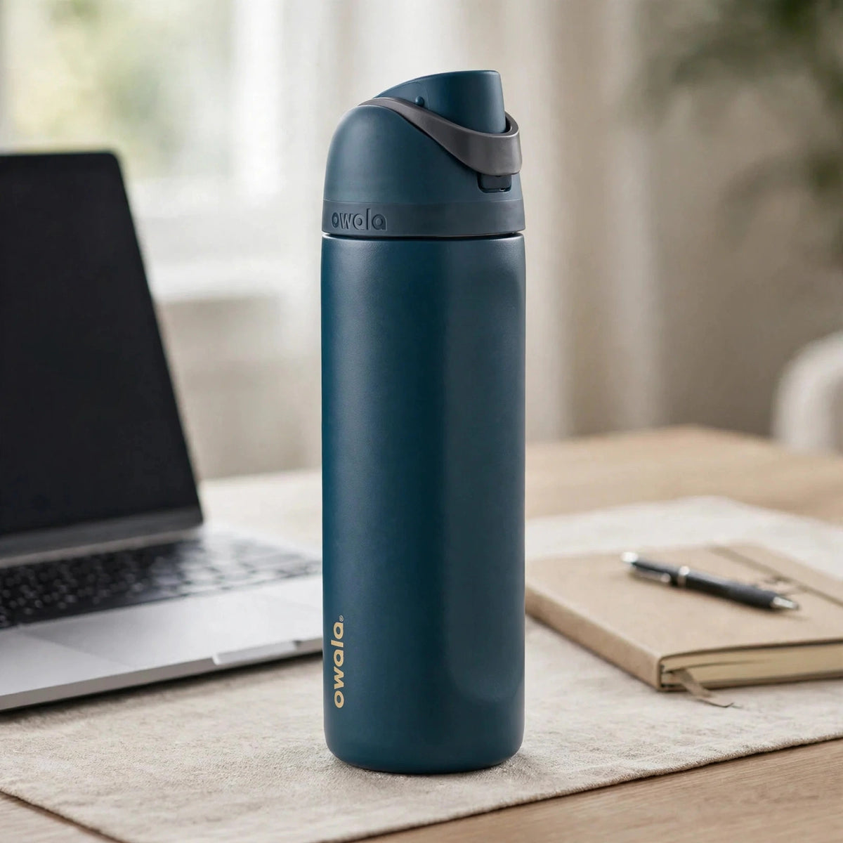 Owala FreeSip Stainless Steel Water Bottle - desk