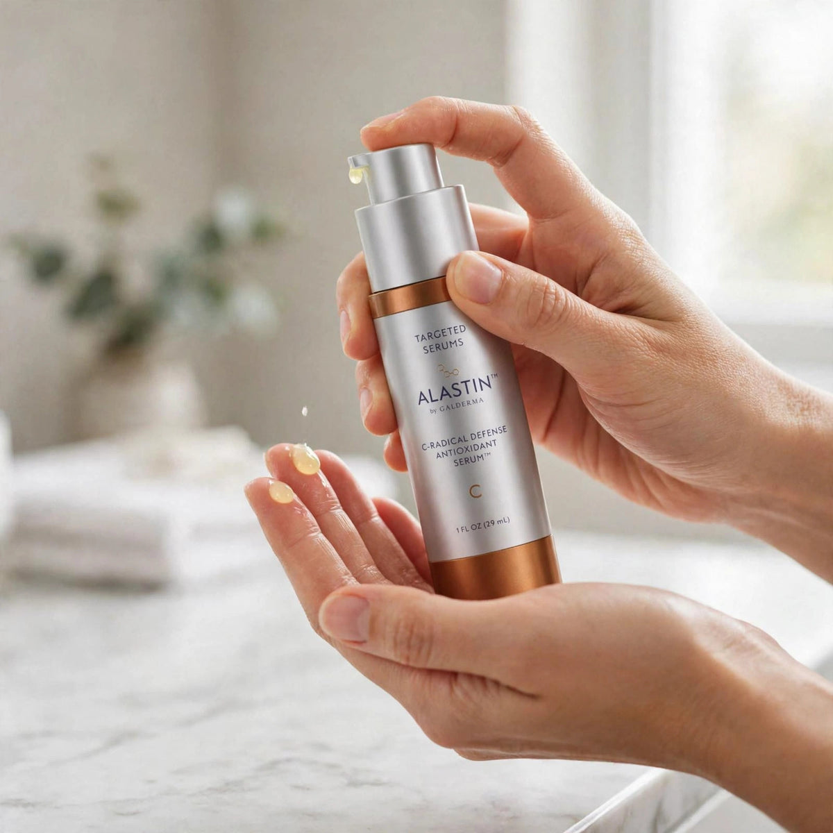 Alastin C-Radical Defense Antioxidant Serum 29.6ml — hand applying the product