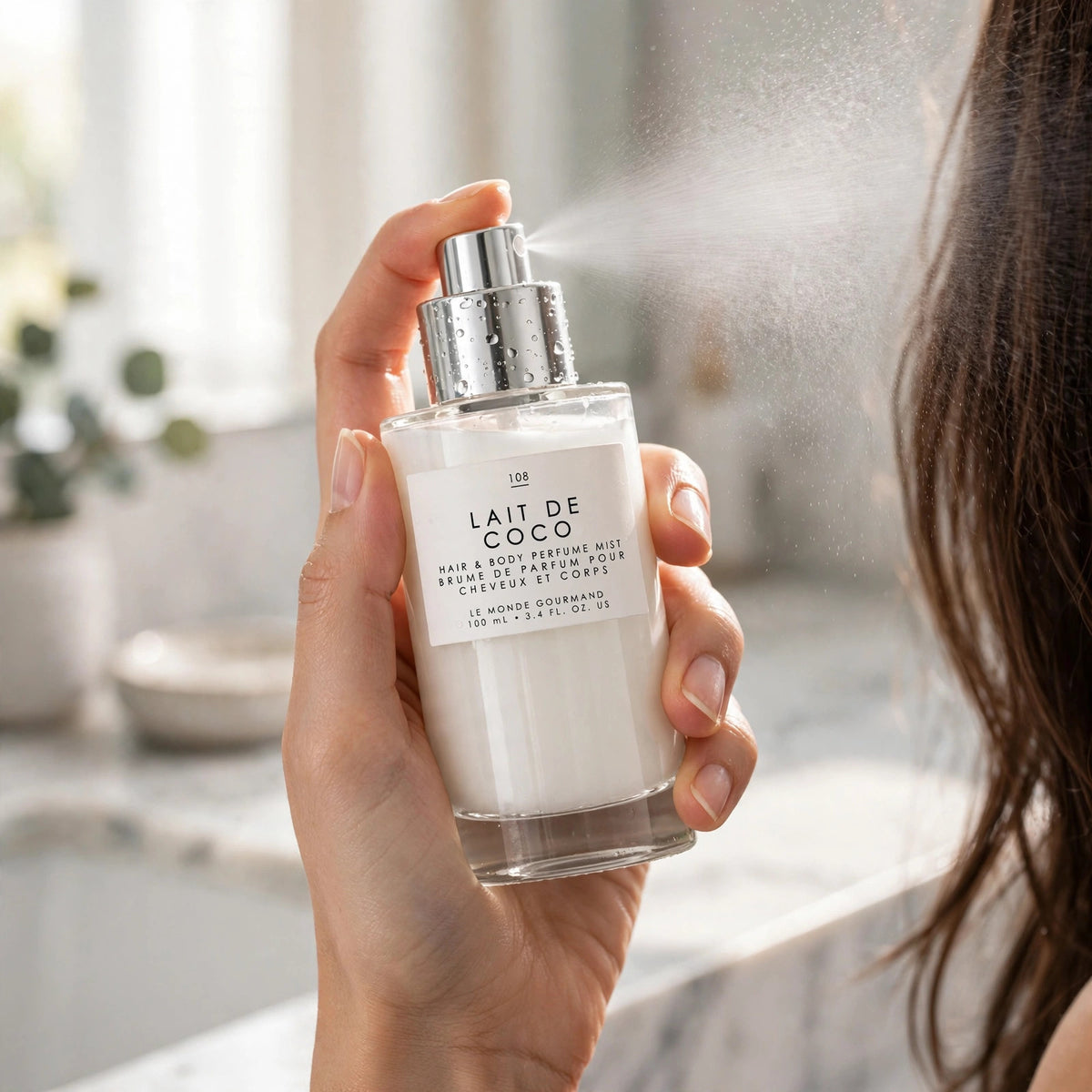 How to use: misting Le Monde Gourmand Lait de Coco Hair & Body Mist near hair