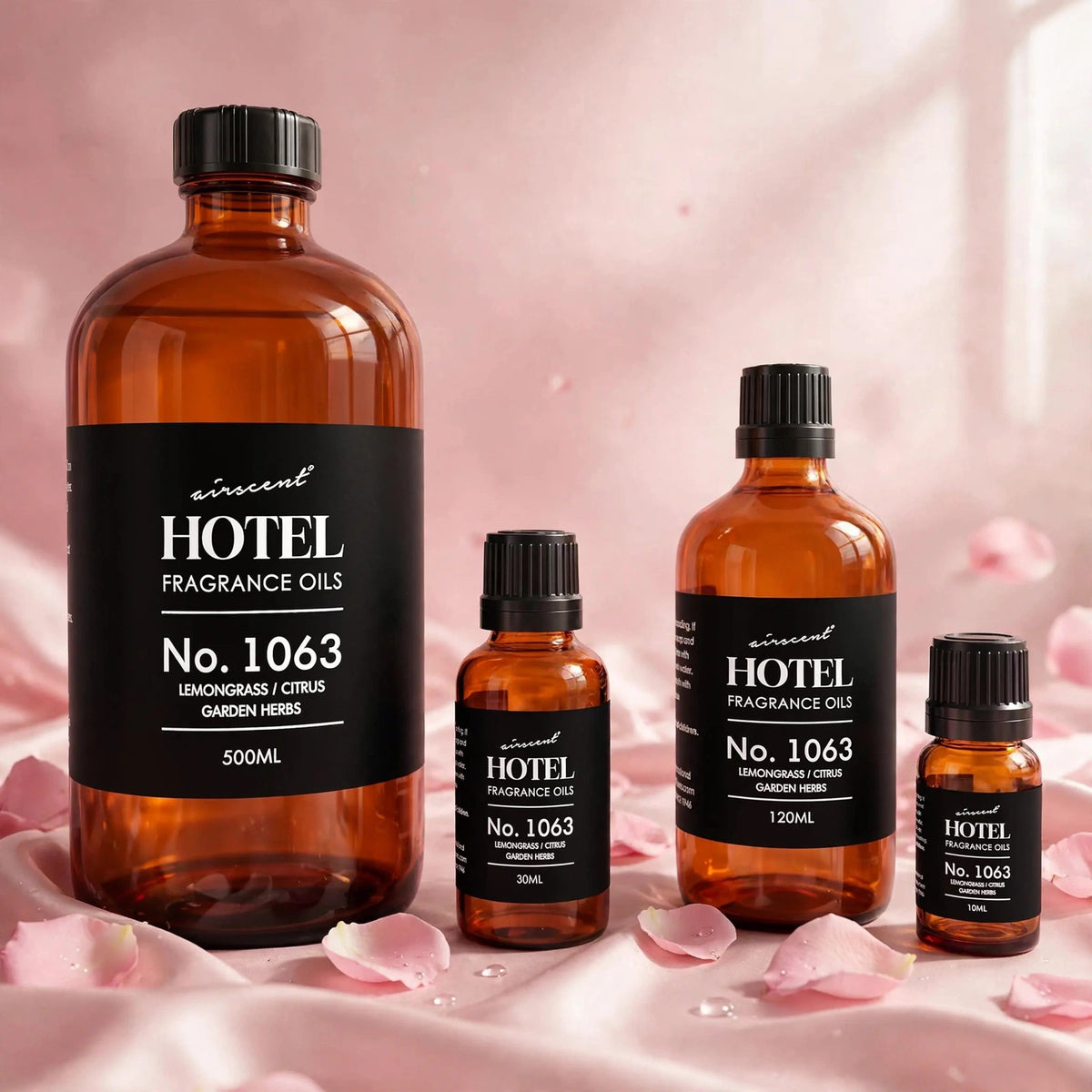 Hotel Collection Aroma 360 Essential Oil 500ml — product on blush-pink satin with rose petals