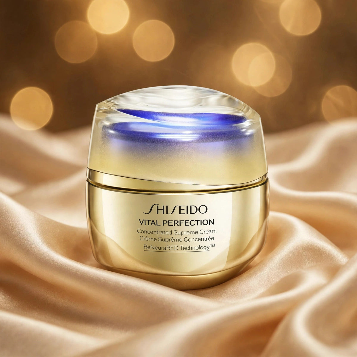 Shiseido Vital Perfection Concentrated Supreme Cream 50ml on champagne silk with golden bokeh