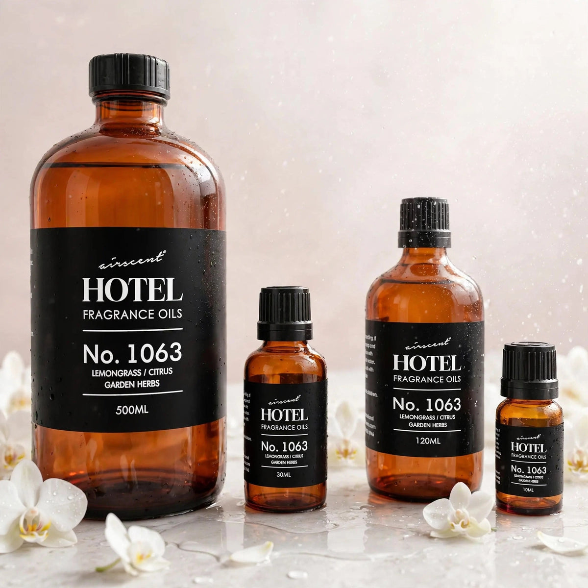 Hotel Collection Aroma 360 Essential Oil 500ml — product with white orchids in spa setting