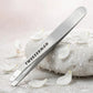 Tweezerman Classic Stainless Steel Slant Tweezer — product with white orchids in spa setting