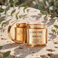 Lancôme Absolue Revitalizing Brightening Soft Cream 2oz — product on travertine stone with eucalyptus