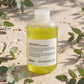 Davines MOMO Moisturizing Shampoo 250ml — product on travertine stone with eucalyptus