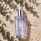 Kérastase Blond Absolu Huile Cicaextreme 100ml — product on travertine stone with eucalyptus