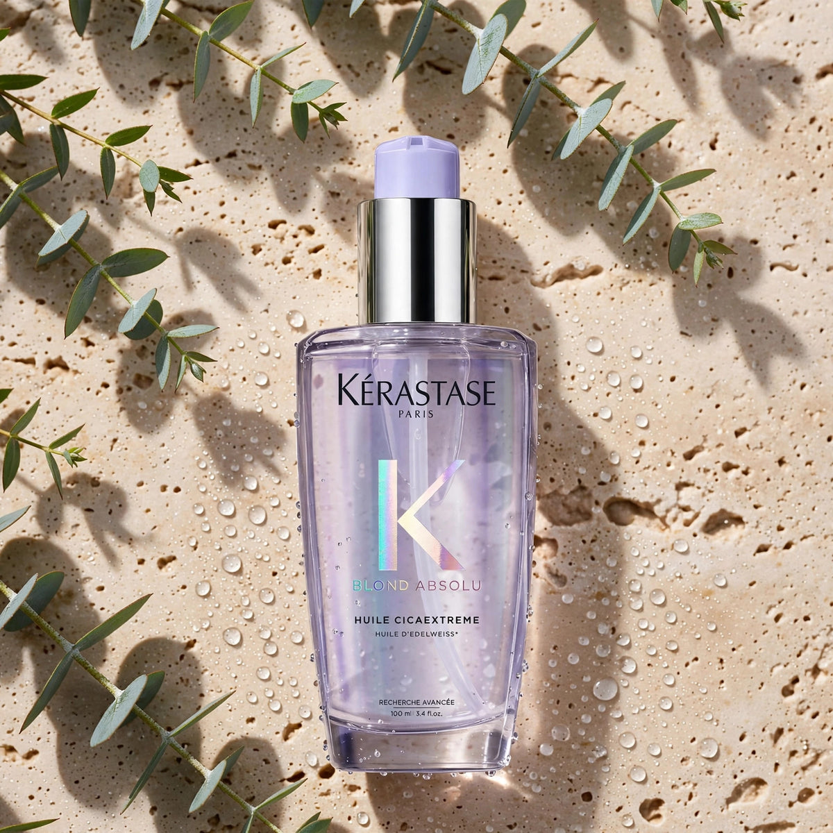 Kérastase Blond Absolu Huile Cicaextreme 100ml — product on travertine stone with eucalyptus