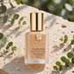 Estée Lauder Double Wear Stay-in-Place Makeup SPF 10 — product on travertine stone with eucalyptus