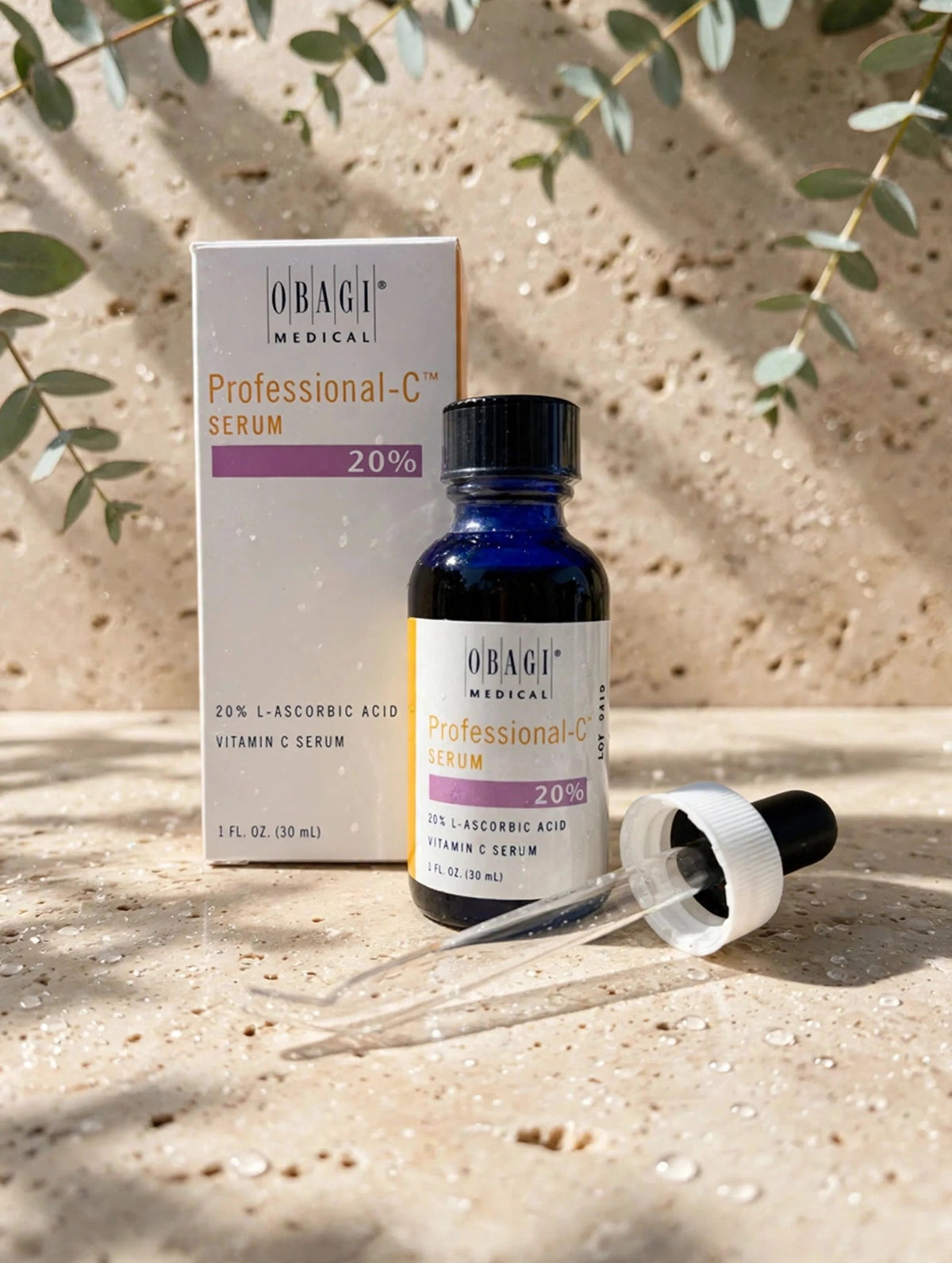 Obagi Professional-C Serum 20% 30ml on travertine stone with eucalyptus